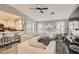 Bright living room with neutral walls, luxury vinyl floors, and views into the kitchen at 7250 Diamond Canyon Ln # 204, Las Vegas, NV 89149
