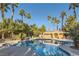 Inviting swimming pool surrounded by palm trees and lounge chairs, perfect for relaxation and enjoying the outdoors at 7250 Diamond Canyon Ln # 204, Las Vegas, NV 89149