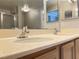 Bright bathroom featuring a double sink vanity and a large mirror at 7450 S Eastern Ave # 1059, Las Vegas, NV 89123
