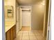 Bathroom featuring tile floor, double door closet, and vanity at 7450 S Eastern Ave # 1059, Las Vegas, NV 89123