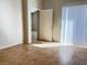 Bright bedroom with tile flooring and sliding door access to a patio or balcony at 7450 S Eastern Ave # 1059, Las Vegas, NV 89123