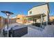 A fully fenced backyard offers a covered patio, cat enclosure, gravel and patio areas, perfect for outdoor entertaining at 7605 Moore Creek Ln, North Las Vegas, NV 89084