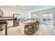 Eat-in kitchen boasts stainless appliances, granite counters, and sliding door access to an outdoor patio at 7605 Moore Creek Ln, North Las Vegas, NV 89084