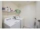 Laundry room with side by side washing machine and dryer at 7605 Moore Creek Ln, North Las Vegas, NV 89084