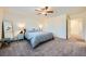 Comfortable main bedroom with a full-length mirror and cozy carpet at 7605 Moore Creek Ln, North Las Vegas, NV 89084