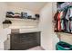 Functional walk-in closet features a built-in dresser and clothing racks at 7605 Moore Creek Ln, North Las Vegas, NV 89084
