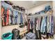 Organized walk-in closet with ample storage and clothing racks at 7605 Moore Creek Ln, North Las Vegas, NV 89084
