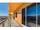 Spacious condo balcony with glass railing overlooks scenic cityscape with desert mountain views at 8255 Las Vegas Blvd # 1315, Las Vegas, NV 89123