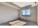 This bedroom features a large window with a view and neutral-colored walls at 8255 Las Vegas Blvd # 1315, Las Vegas, NV 89123