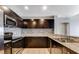 Modern kitchen featuring stainless steel appliances, granite countertops, and stylish backsplash at 8255 Las Vegas Blvd # 1315, Las Vegas, NV 89123