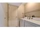 This laundry room features a full-size washer, dryer, and storage shelf at 8255 Las Vegas Blvd # 1315, Las Vegas, NV 89123