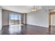 Spacious living room features hardwood floors, sliding glass doors to balcony and neutral wall paint at 8255 Las Vegas Blvd # 1315, Las Vegas, NV 89123