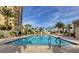 Enjoy this beautiful large pool with palm trees and lounge seating at this building at 8255 Las Vegas Blvd # 1315, Las Vegas, NV 89123