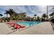 Relax at this pool with lounge seating and palm trees at this beautiful building at 8255 Las Vegas Blvd # 1315, Las Vegas, NV 89123