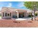 Charming backyard offering comfortable patio seating and a beautiful desert landscape with mature shade trees at 8812 Marble Dr, Las Vegas, NV 89134