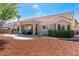 Attractive backyard featuring a covered patio, low-maintenance desert landscaping and well-maintained exterior at 8812 Marble Dr, Las Vegas, NV 89134
