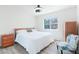 Comfortable bedroom with neutral tones, a ceiling fan, and natural light at 8812 Marble Dr, Las Vegas, NV 89134