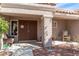 Inviting front porch with double door entry, charming seating area, and decorative accents at 8812 Marble Dr, Las Vegas, NV 89134
