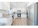 Bright kitchen features stainless steel appliances, granite countertops, and white cabinetry at 8812 Marble Dr, Las Vegas, NV 89134