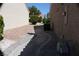 This side yard features a landscaped walkway between homes, enhancing privacy and curb appeal at 8812 Marble Dr, Las Vegas, NV 89134