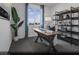 Bright secondary bedroom with ample natural light, a spacious desk, and minimalist decor at 887 Apatite Pl # Lot 58, Henderson, NV 89011