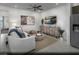 Comfortable living room with stylish decor, neutral tones, and a sleek entertainment center at 887 Apatite Pl # Lot 58, Henderson, NV 89011