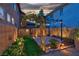 Landscaped backyard with a charming pergola and a wooden deck, perfect for outdoor relaxation at 8944 Campanella St, Las Vegas, NV 89123
