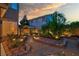 Serene backyard with a stone pathway, pergola, and colorful landscaping, creating a peaceful outdoor retreat at 8944 Campanella St, Las Vegas, NV 89123
