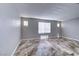 Large bedroom featuring a large window allowing for natural light and stunning tile floors at 8944 Campanella St, Las Vegas, NV 89123