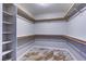 Walk-in closet with built-in shelving and drawers, maximizing storage space at 8944 Campanella St, Las Vegas, NV 89123