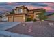 Charming two-story home with a three car garage, landscaped yard, and a warm inviting entrance at 8944 Campanella St, Las Vegas, NV 89123