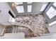 Grand staircase featuring a decorative runner leading to the bright, open living space with skylights at 8944 Campanella St, Las Vegas, NV 89123