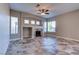 Living room featuring fireplace, recessed lighting, and multiple windows illuminating the tile floors at 8944 Campanella St, Las Vegas, NV 89123