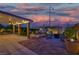 Relaxing outdoor patio with a jacuzzi, lounge chairs, and ambient lighting, creating a perfect relaxation spot at 8944 Campanella St, Las Vegas, NV 89123