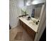 Full bathroom featuring a long vanity with ample countertop space and a shower/tub combo at 898 Flagstone Way, Las Vegas, NV 89110