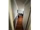 Bedroom entrance showing hardwood floors, neutral paint and a glimpse of a tranquil space at 898 Flagstone Way, Las Vegas, NV 89110