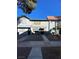 Exterior shot of a townhouse featuring neutral color schemes and well-maintained landscaping at 898 Flagstone Way, Las Vegas, NV 89110