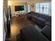 Comfortable living room with large sectional sofa, TV, and large window. Ideal for relaxing and entertaining at 898 Flagstone Way, Las Vegas, NV 89110