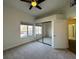 Bedroom with window and mirrored closet doors at 8985 S Durango Dr # 1010, Las Vegas, NV 89113