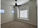 Bedroom featuring a ceiling fan, carpeted floor, and a window with blinds at 8985 S Durango Dr # 1010, Las Vegas, NV 89113