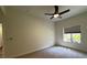 Bedroom featuring a ceiling fan, carpeted floor, and a window with blinds at 8985 S Durango Dr # 1010, Las Vegas, NV 89113