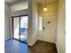 Bright entryway with tile floor, pendant light, and sliding glass door to the balcony at 8985 S Durango Dr # 1010, Las Vegas, NV 89113