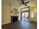 Bright living room with fireplace and sliding glass doors leading to the outdoor patio at 8985 S Durango Dr # 1010, Las Vegas, NV 89113