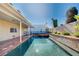 Backyard features a long pool, jacuzzi and covered patio area at 902 Dianne Dr, Boulder City, NV 89005