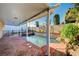 Outdoor patio area overlooking a pool and jacuzzi in backyard at 902 Dianne Dr, Boulder City, NV 89005
