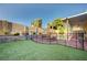 Fenced backyard with artificial grass, pool and jacuzzi at 902 Dianne Dr, Boulder City, NV 89005