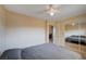 Comfortable bedroom with a queen-sized bed, carpet, view of closet, and ceiling fan at 902 Dianne Dr, Boulder City, NV 89005