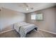 Cozy bedroom features neutral walls, carpet, ceiling fan and a window for natural light at 902 Dianne Dr, Boulder City, NV 89005