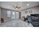 Bedroom with a ceiling fan, a decorative statue, and a large window at 902 Dianne Dr, Boulder City, NV 89005