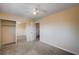 Bedroom with carpet flooring, standard closet with sliding mirrored doors, and ceiling fan at 902 Dianne Dr, Boulder City, NV 89005